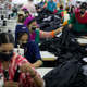 In this April 19, 2018 photo, Bangladeshis work at Snowtex garment factory in Dhamrai, near Dhaka, Bangladesh. A new survey says that five years after the Rana Plaza garment factory building collapse in Bangladesh killed 1,134 people and left thousands injured some things have changed for the better for the workers who toiled in the country's huge garment industry but much remains to be done. The survey by the Center for Business and Human Rights at New York University's Stern School of Business found that the largest factories generally have complied with new safety standards set by foreign clothing brands since the 2013 accident. (AP Photo/A.M. Ahad)